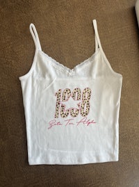 a white tank top with a leopard print on it