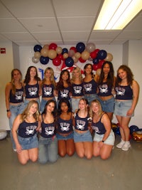 a group of women posing for a picture